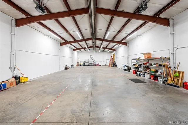 a view of parking garage with cars