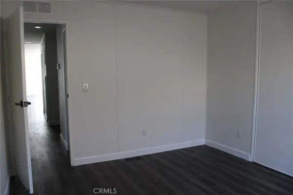 a view of a small space with wooden floor