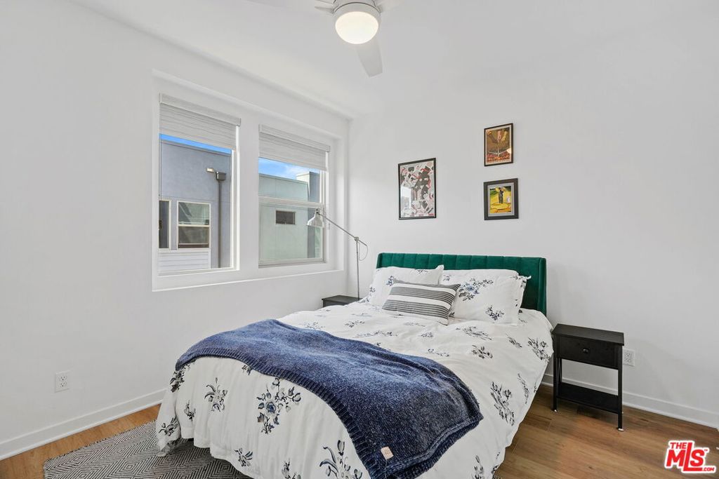 305 Placemark Irvine, CA 92614 - Photo 11 of 20 a bedroom with a bed and painting on the wall