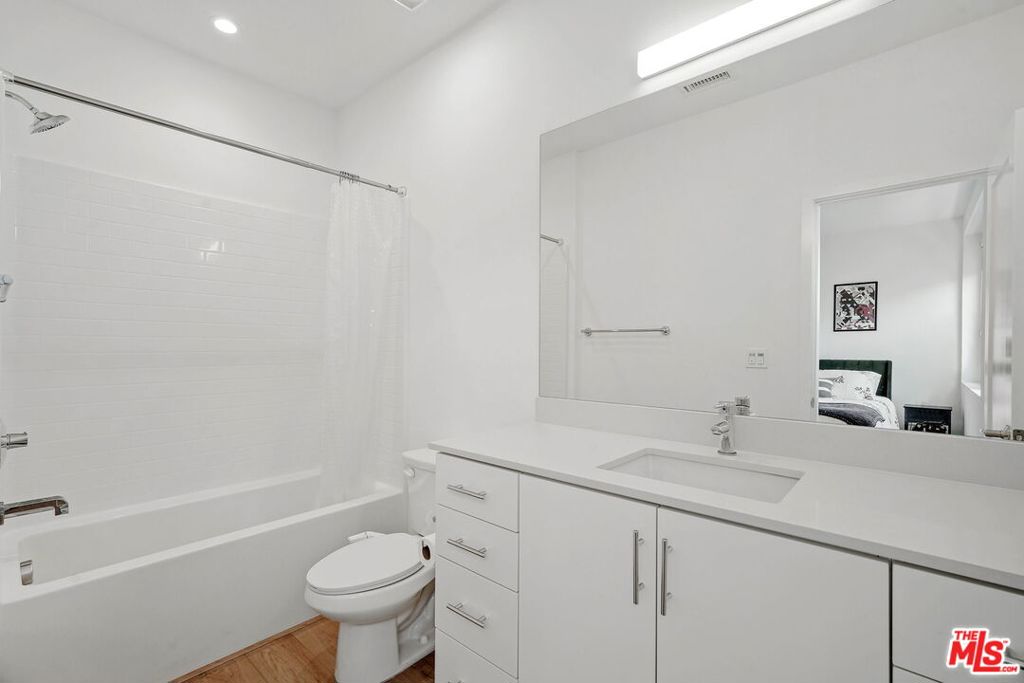 305 Placemark Irvine, CA 92614 - Photo 12 of 20 a bathroom with a sink toilet vanity and shower