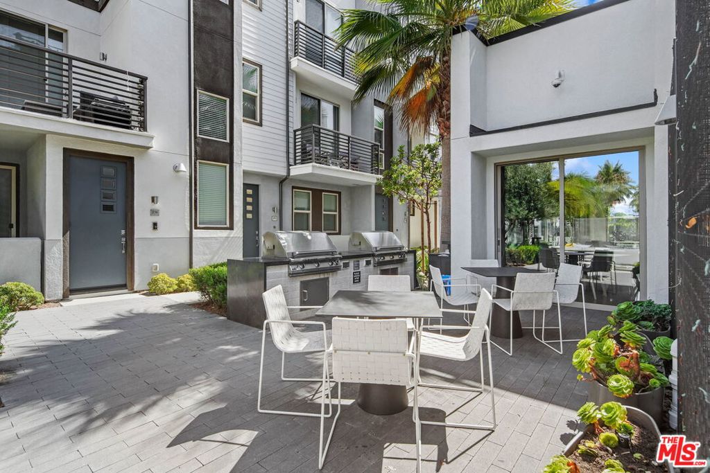 305 Placemark Irvine, CA 92614 - Photo 15 of 20 a view of a patio with chairs and potted plants