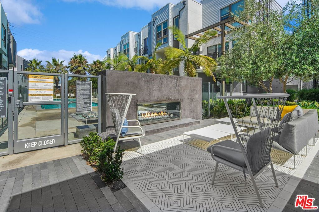 305 Placemark Irvine, CA 92614 - Photo 16 of 20 a patio with table and chairs