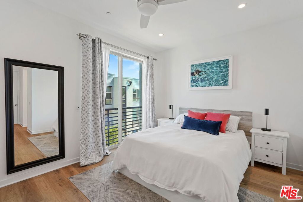 305 Placemark Irvine, CA 92614 - Photo 8 of 20 a bedroom with a large bed and a window