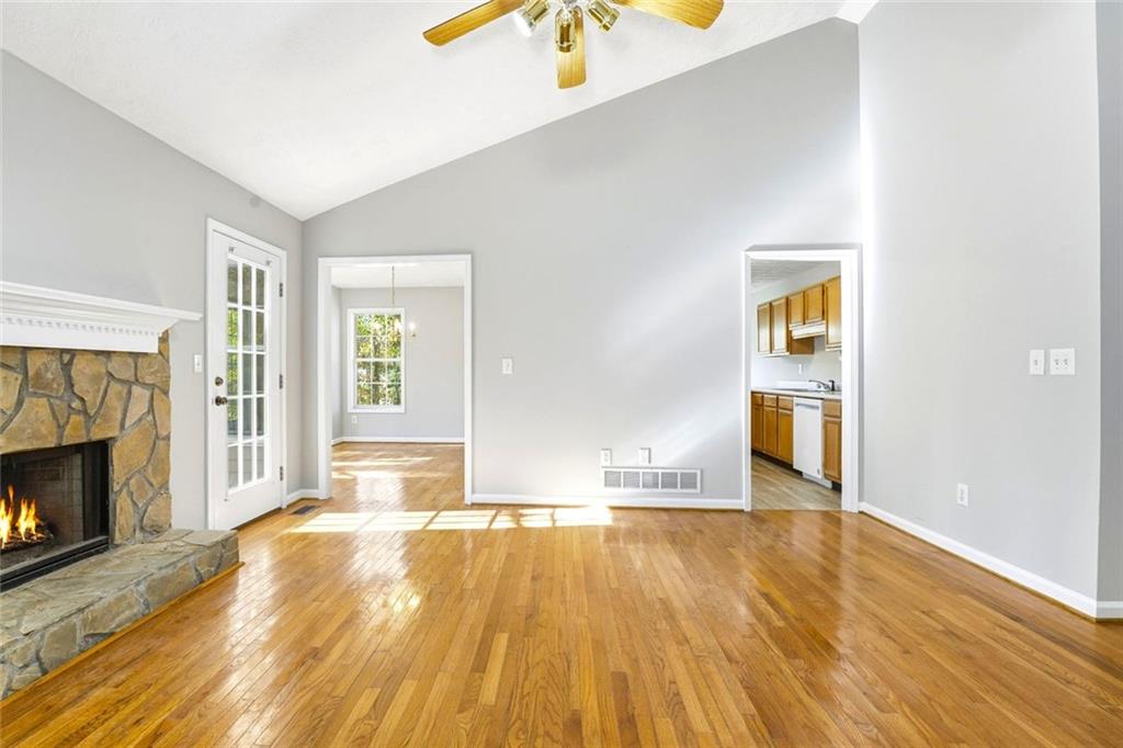 4099 Harvest Ridge Drive Douglasville, GA 30135 - Photo 11 of 46 a view of empty room with wooden floor and fireplace