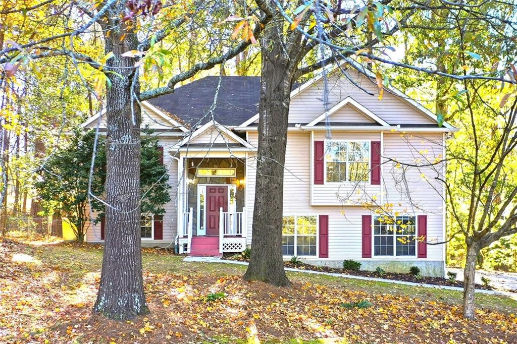 4099 Harvest Ridge Drive Douglasville, GA 30135 - Photo 2 of 46 a front view of a house with a yard