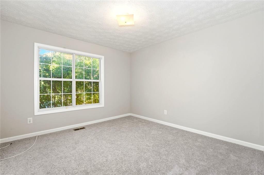 4099 Harvest Ridge Drive Douglasville, GA 30135 - Photo 30 of 46 an empty room with a window