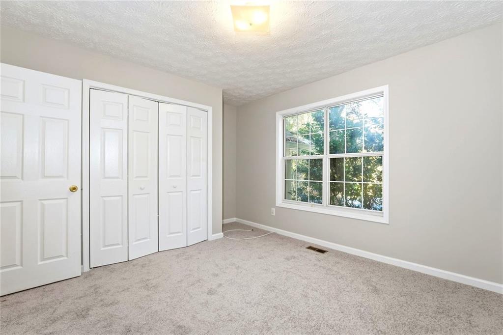 4099 Harvest Ridge Drive Douglasville, GA 30135 - Photo 31 of 46 an empty room with windows