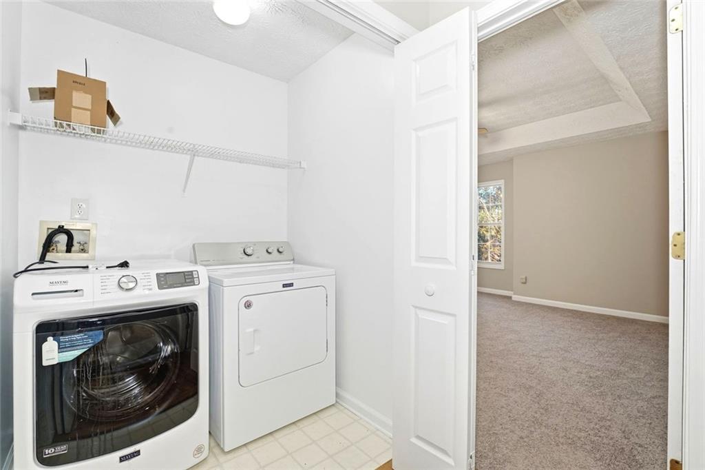 4099 Harvest Ridge Drive Douglasville, GA 30135 - Photo 32 of 46 a utility room with dryer and washer