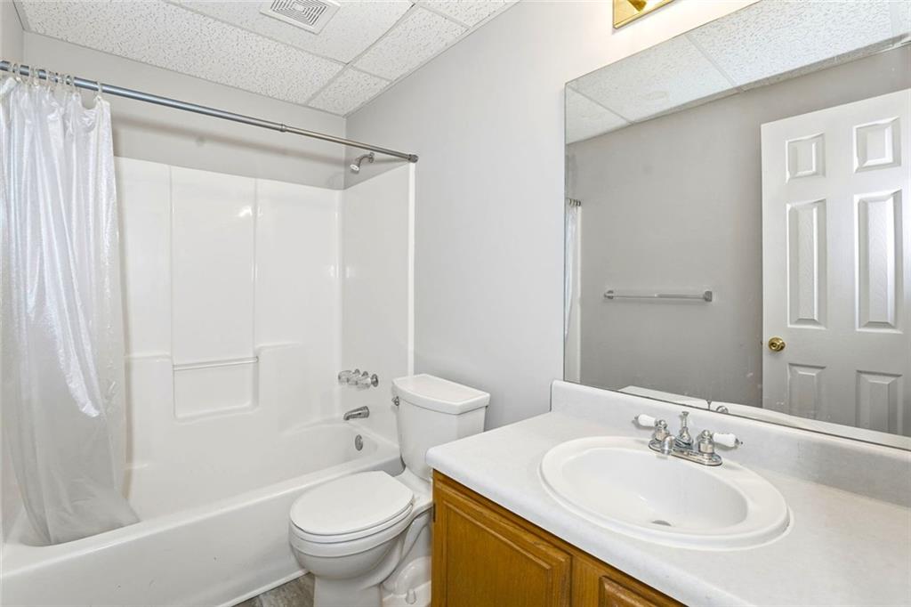 4099 Harvest Ridge Drive Douglasville, GA 30135 - Photo 36 of 46 a bathroom with a sink toilet and shower