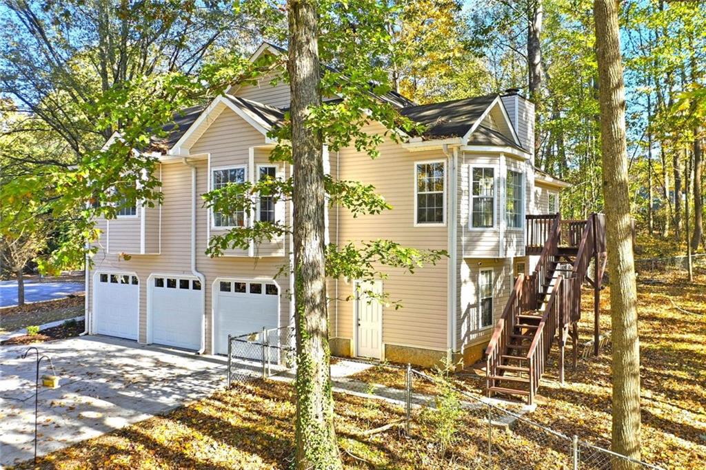 4099 Harvest Ridge Drive Douglasville, GA 30135 - Photo 4 of 46 a front view of a house with a yard