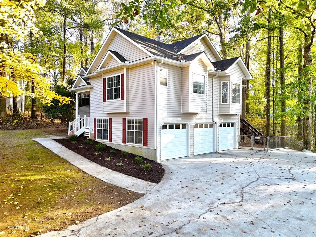 4099 Harvest Ridge Drive Douglasville, GA 30135 - Photo 5 of 46 a view of a house with backyard and trees