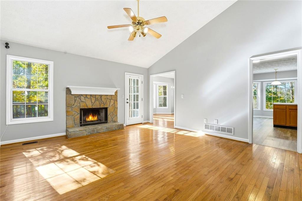 4099 Harvest Ridge Drive Douglasville, GA 30135 - Photo 9 of 46 a view of an empty room with a fireplace and a window
