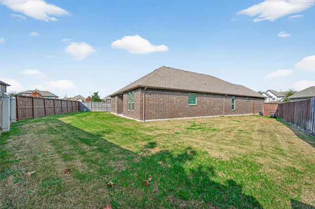 a house view with a backyard space
