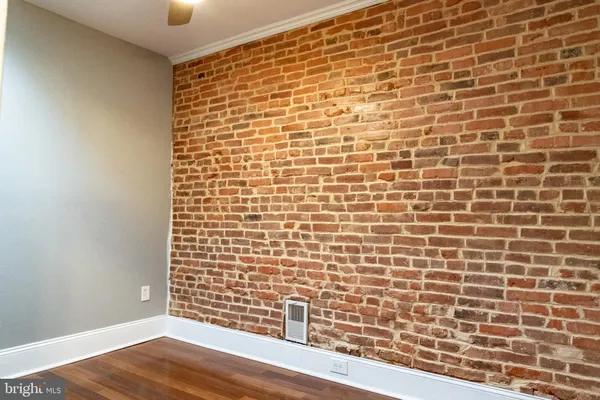 view of an empty room with wooden floor