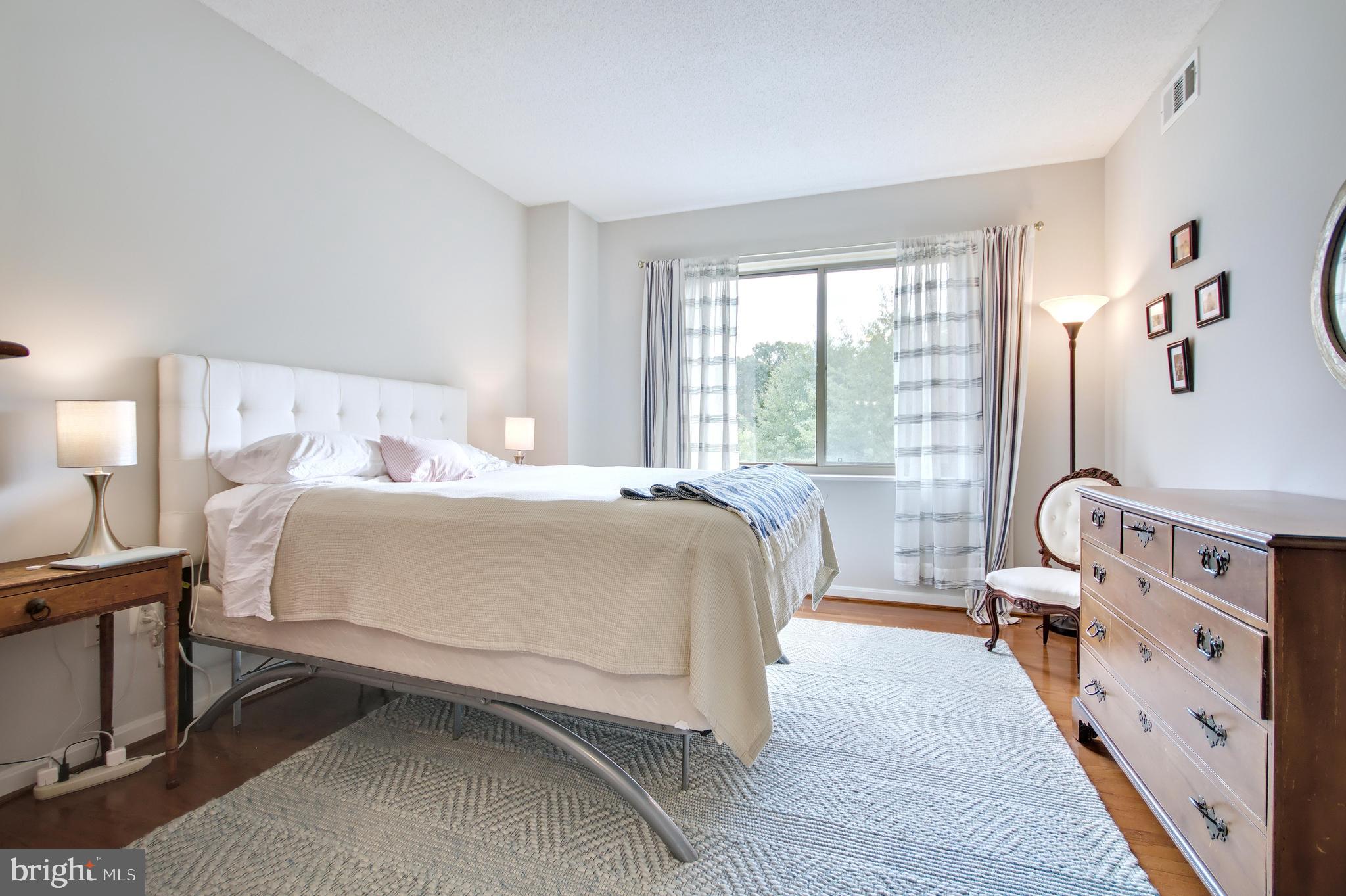 940 Astern Way, Unit 309 Annapolis, MD 21401 - Photo 22 of 52 a bed room with a bed and a chair