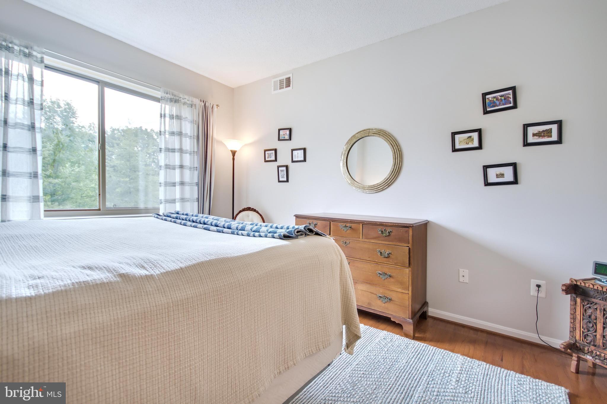 940 Astern Way, Unit 309 Annapolis, MD 21401 - Photo 24 of 52 a bedroom with a bed and a large window