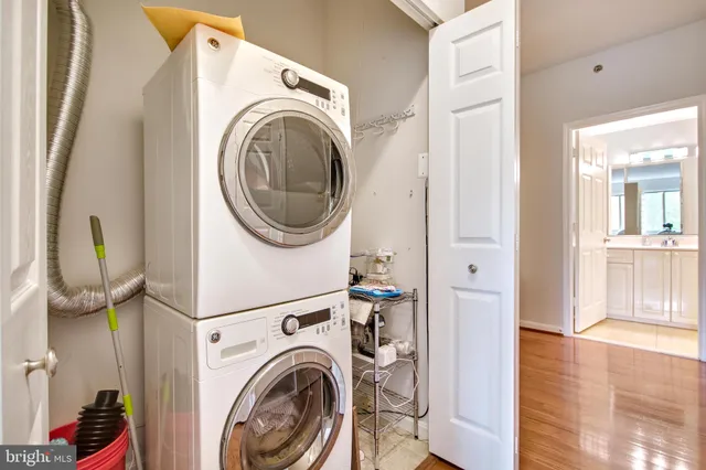 a view of a hallway with washer and dryer