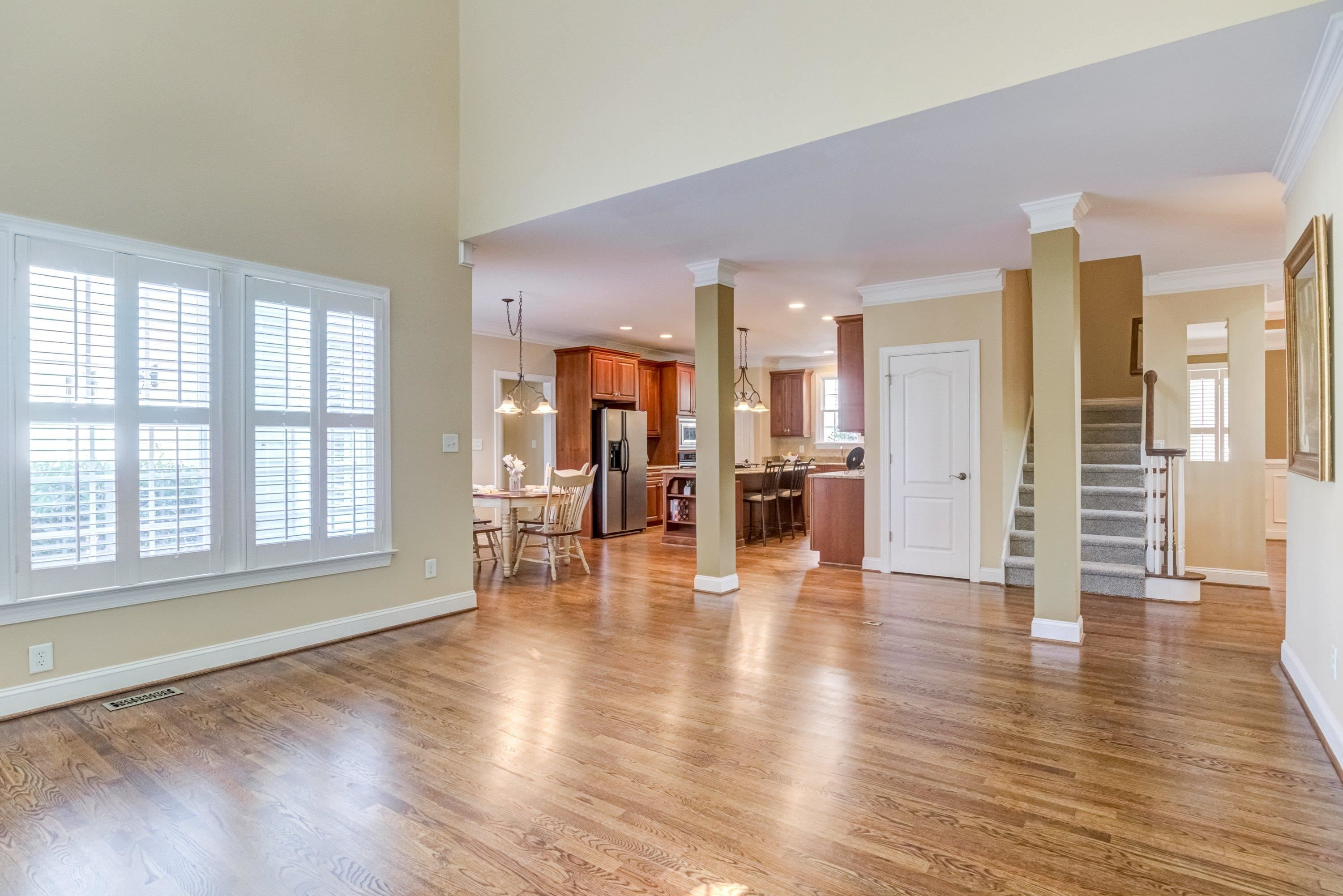 1911 Hornbeck Court Raleigh, NC 27614 - Photo 12 of 47 an empty room with wooden floor and windows