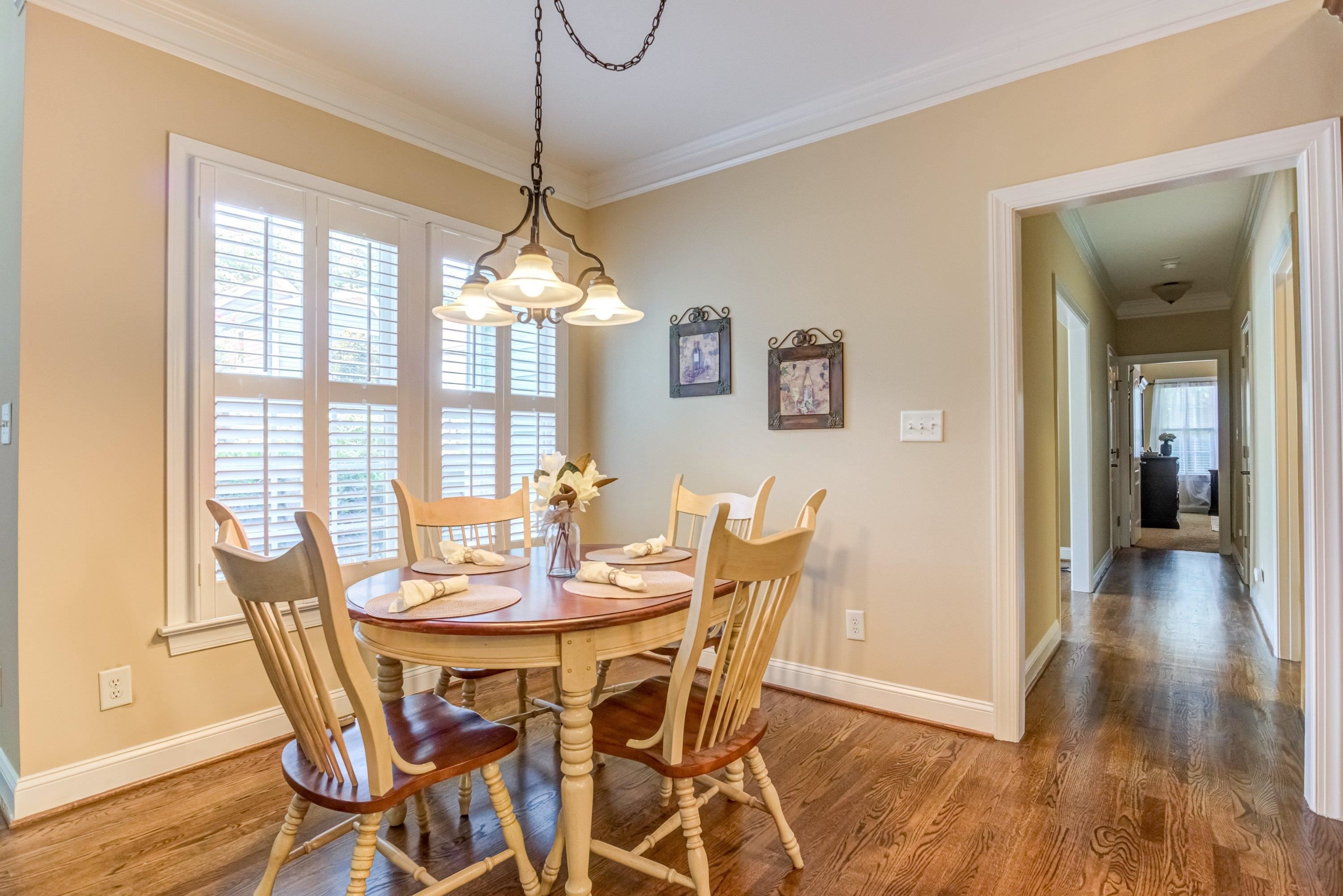 1911 Hornbeck Court Raleigh, NC 27614 - Photo 13 of 47 a view of a dining room with furniture wooden floor and chandelier