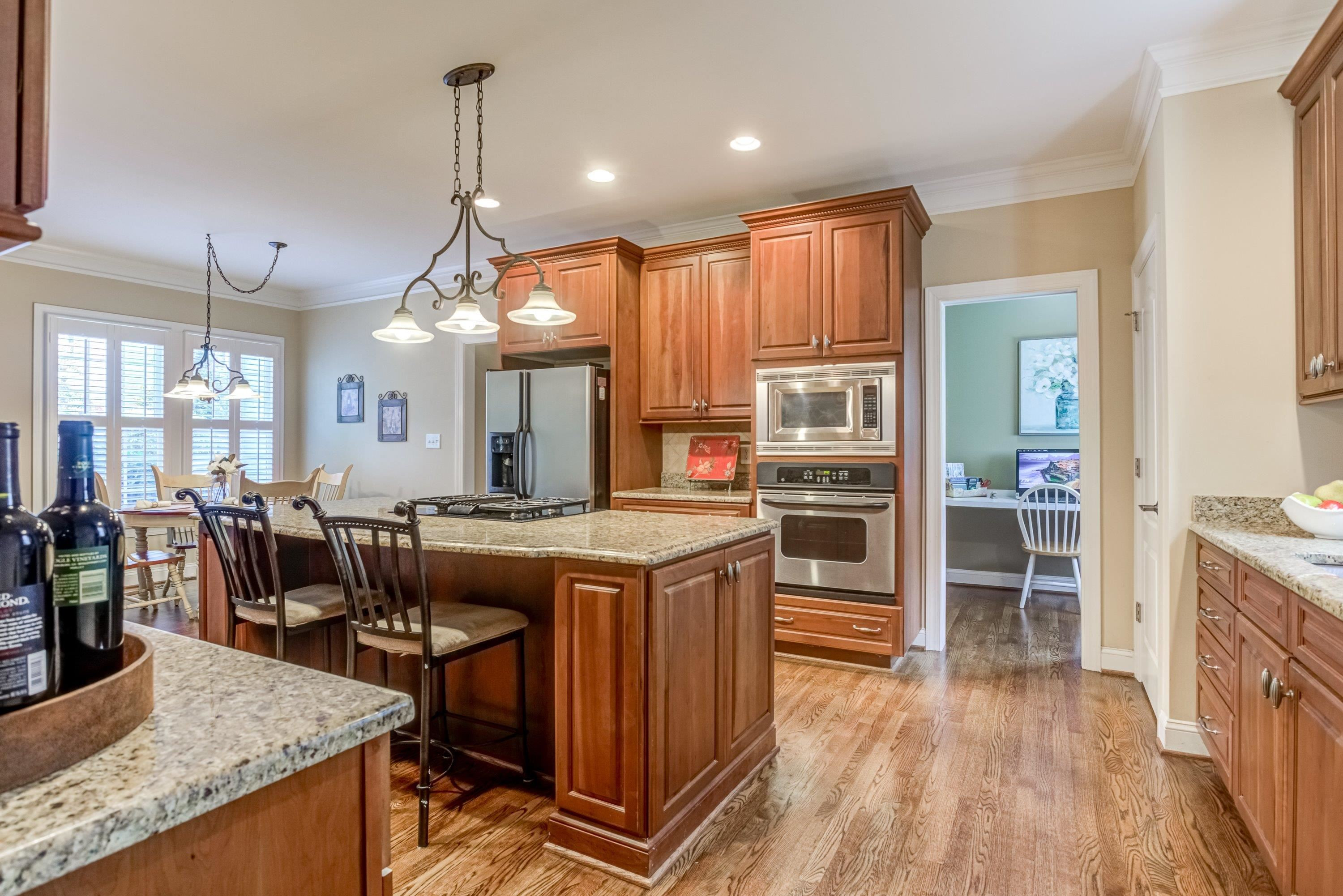 1911 Hornbeck Court Raleigh, NC 27614 - Photo 16 of 47 a kitchen that has a lot of cabinets in it