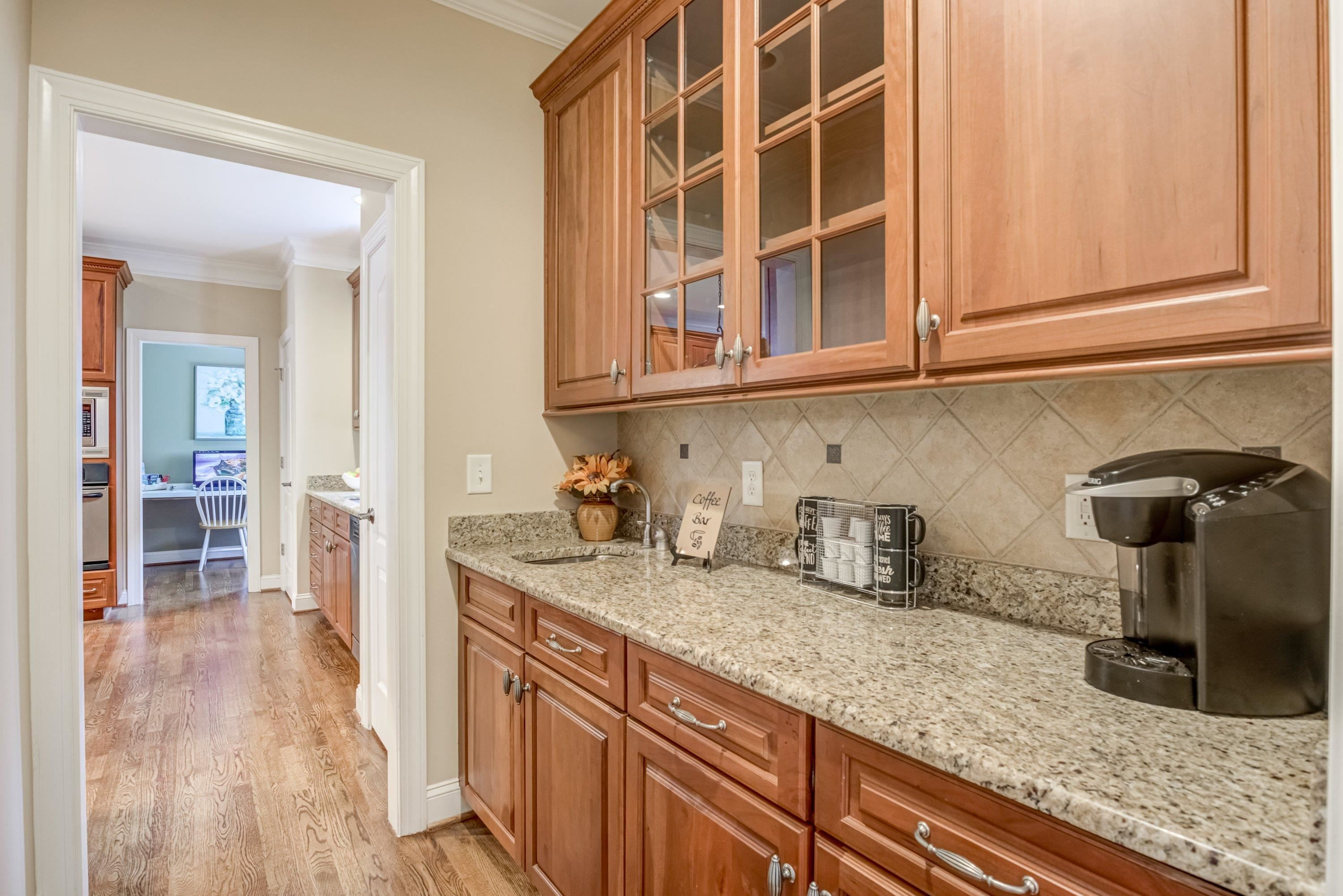 1911 Hornbeck Court Raleigh, NC 27614 - Photo 17 of 47 a kitchen with granite countertop a sink and cabinets