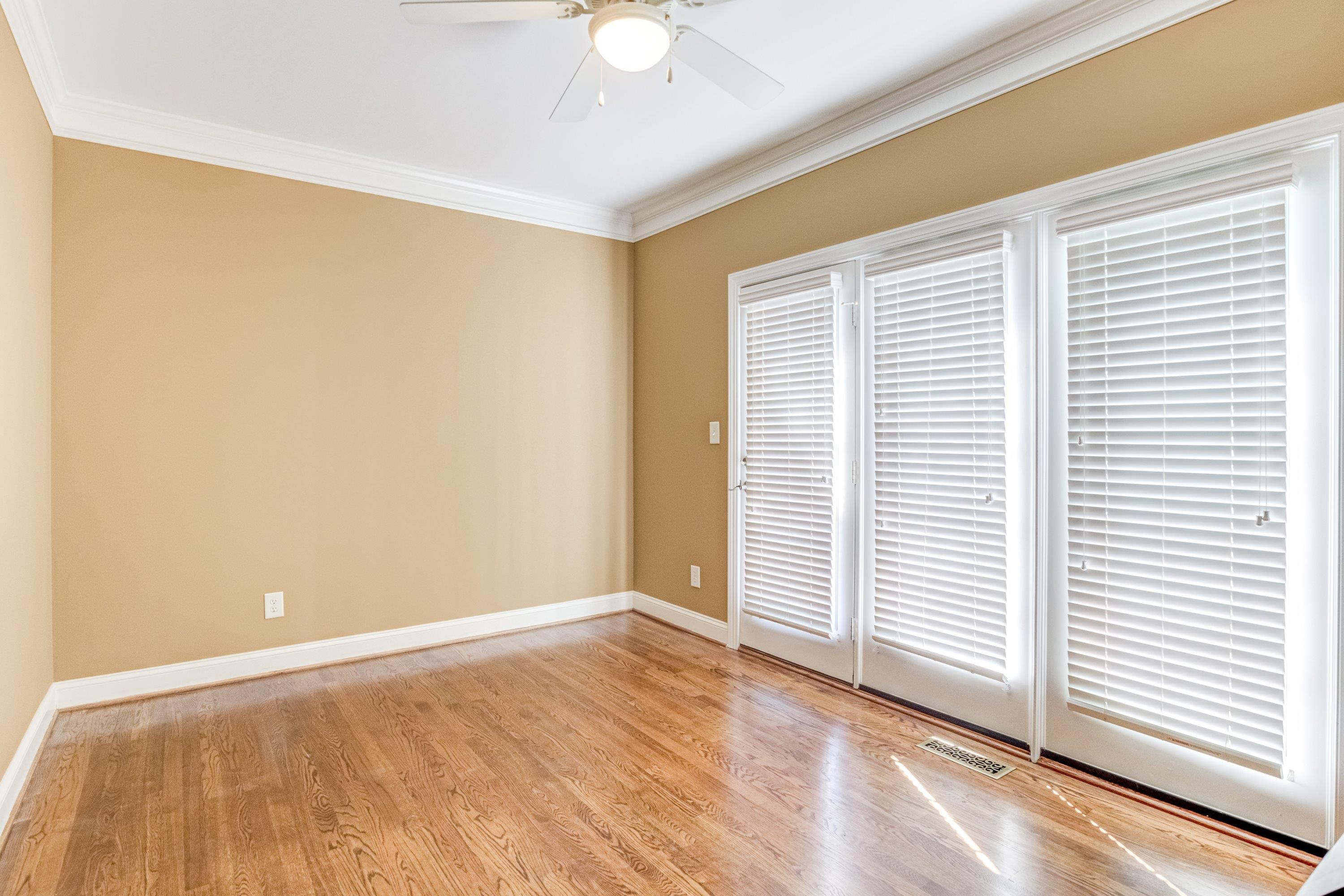 1911 Hornbeck Court Raleigh, NC 27614 - Photo 20 of 47 an empty room with wooden floor and windows