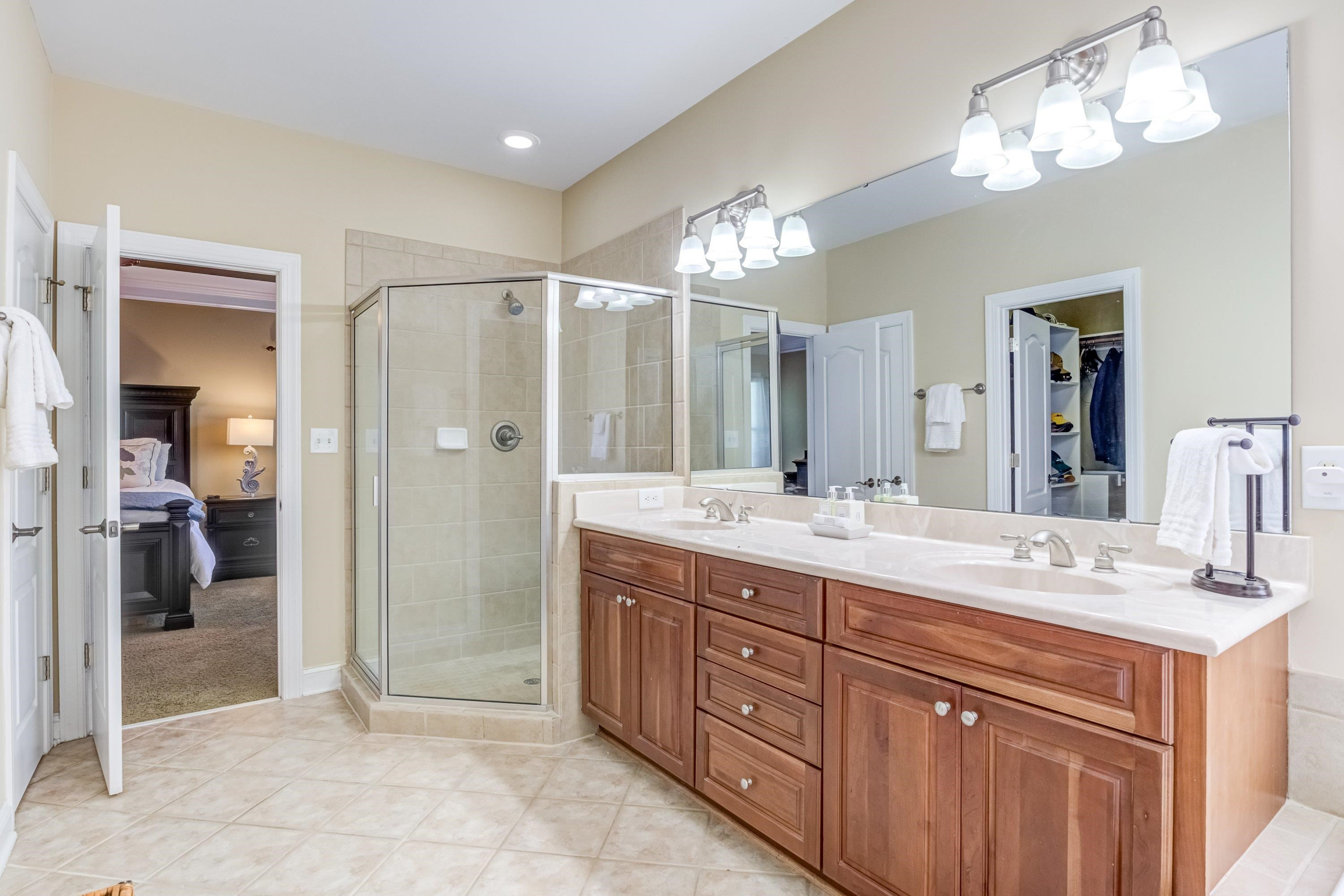 1911 Hornbeck Court Raleigh, NC 27614 - Photo 25 of 47 a bathroom with a double vanity sink and a mirror