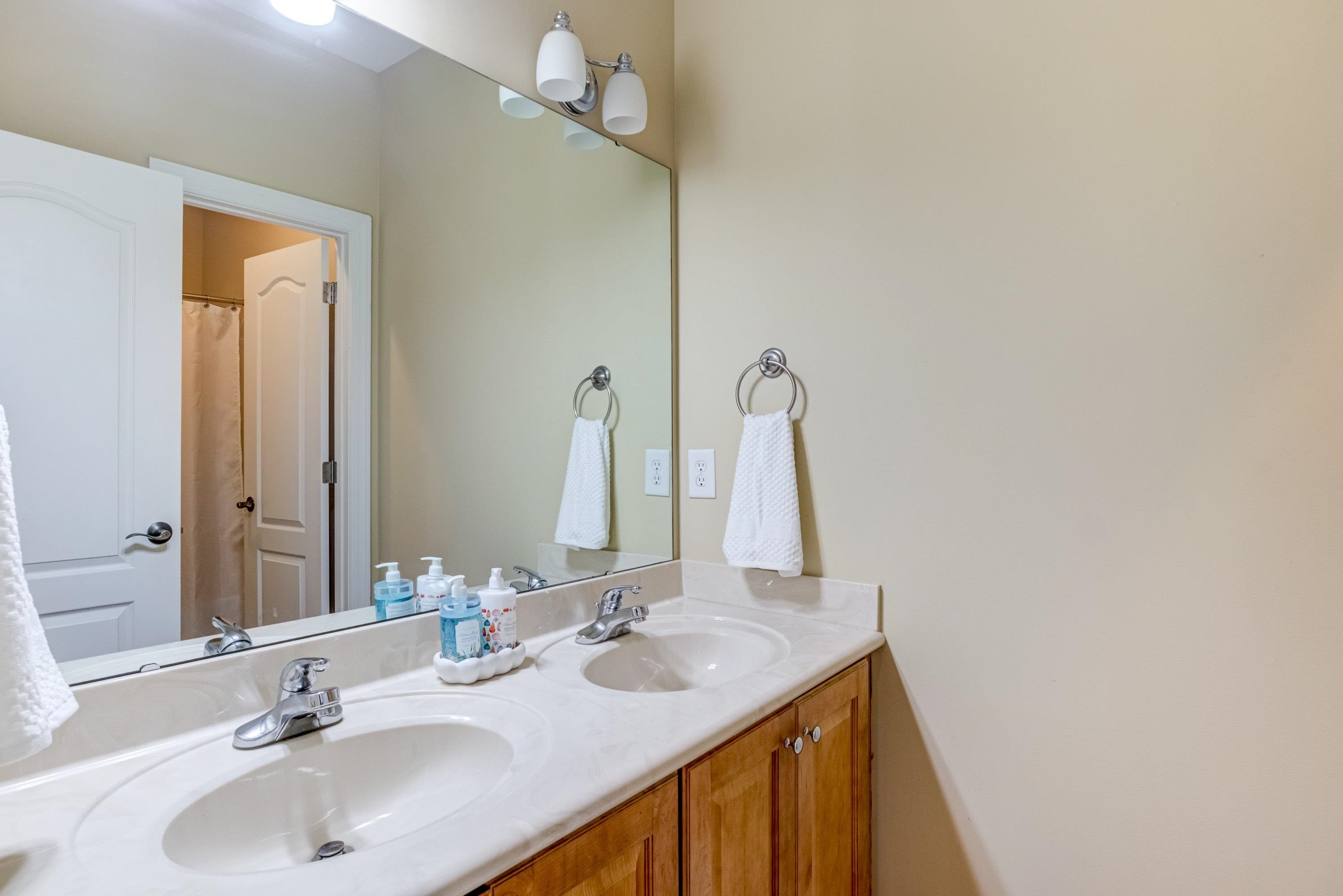 1911 Hornbeck Court Raleigh, NC 27614 - Photo 28 of 47 a bathroom with a sink and a mirror