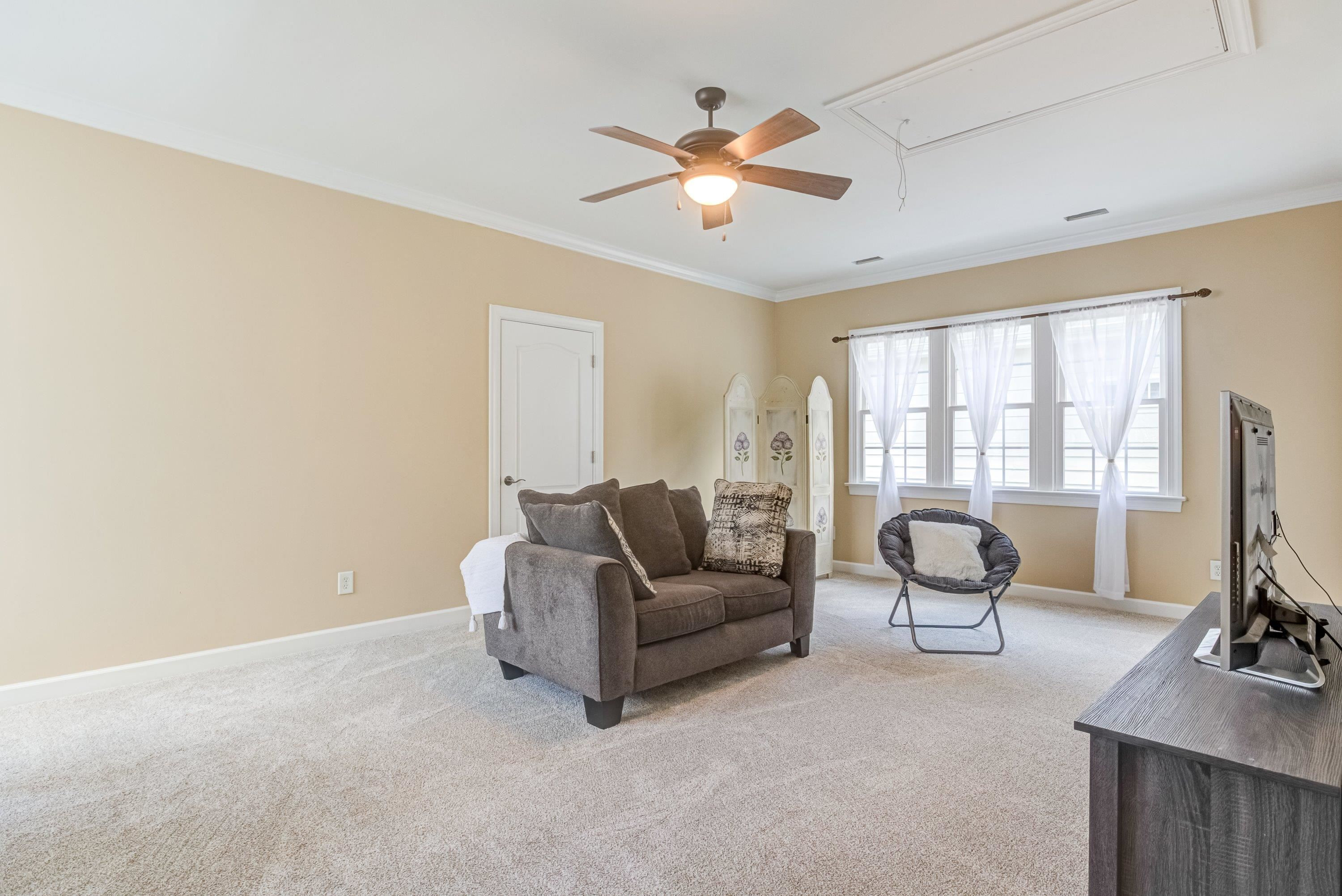 1911 Hornbeck Court Raleigh, NC 27614 - Photo 32 of 47 a living room with furniture and a window