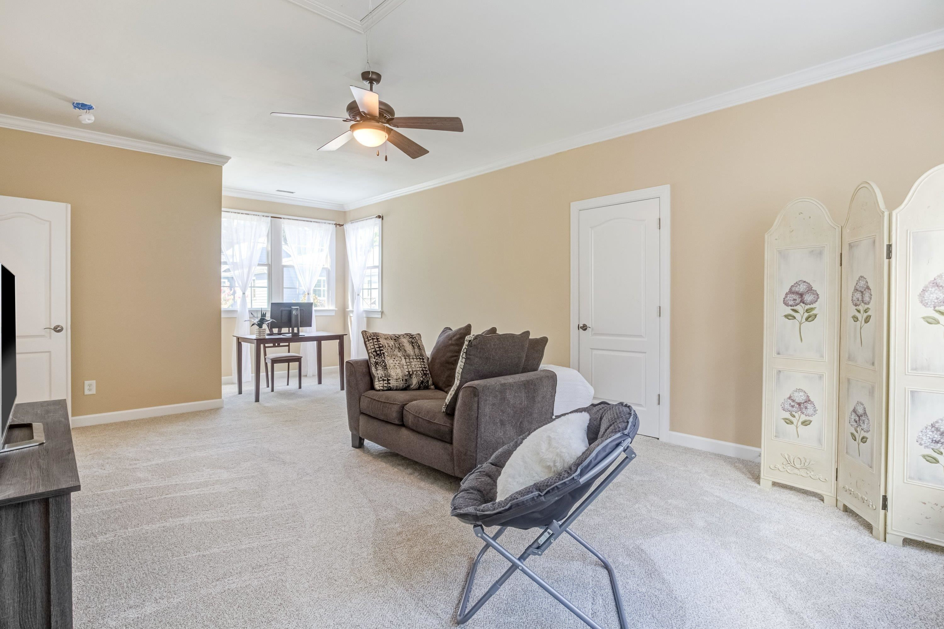 1911 Hornbeck Court Raleigh, NC 27614 - Photo 33 of 47 a living room with furniture and a flat screen tv