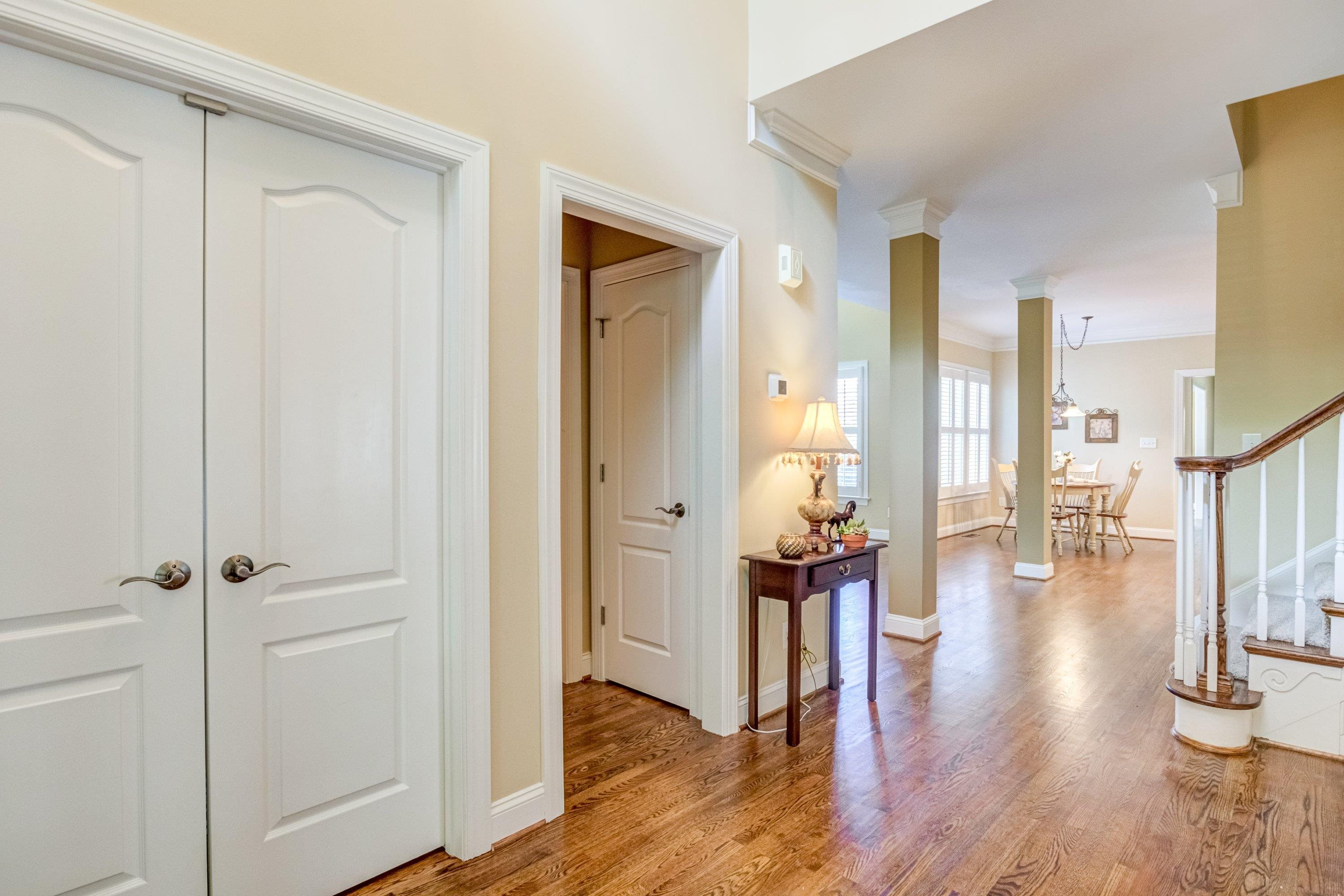 1911 Hornbeck Court Raleigh, NC 27614 - Photo 5 of 47 a view of a hallway with wooden floor and staircase