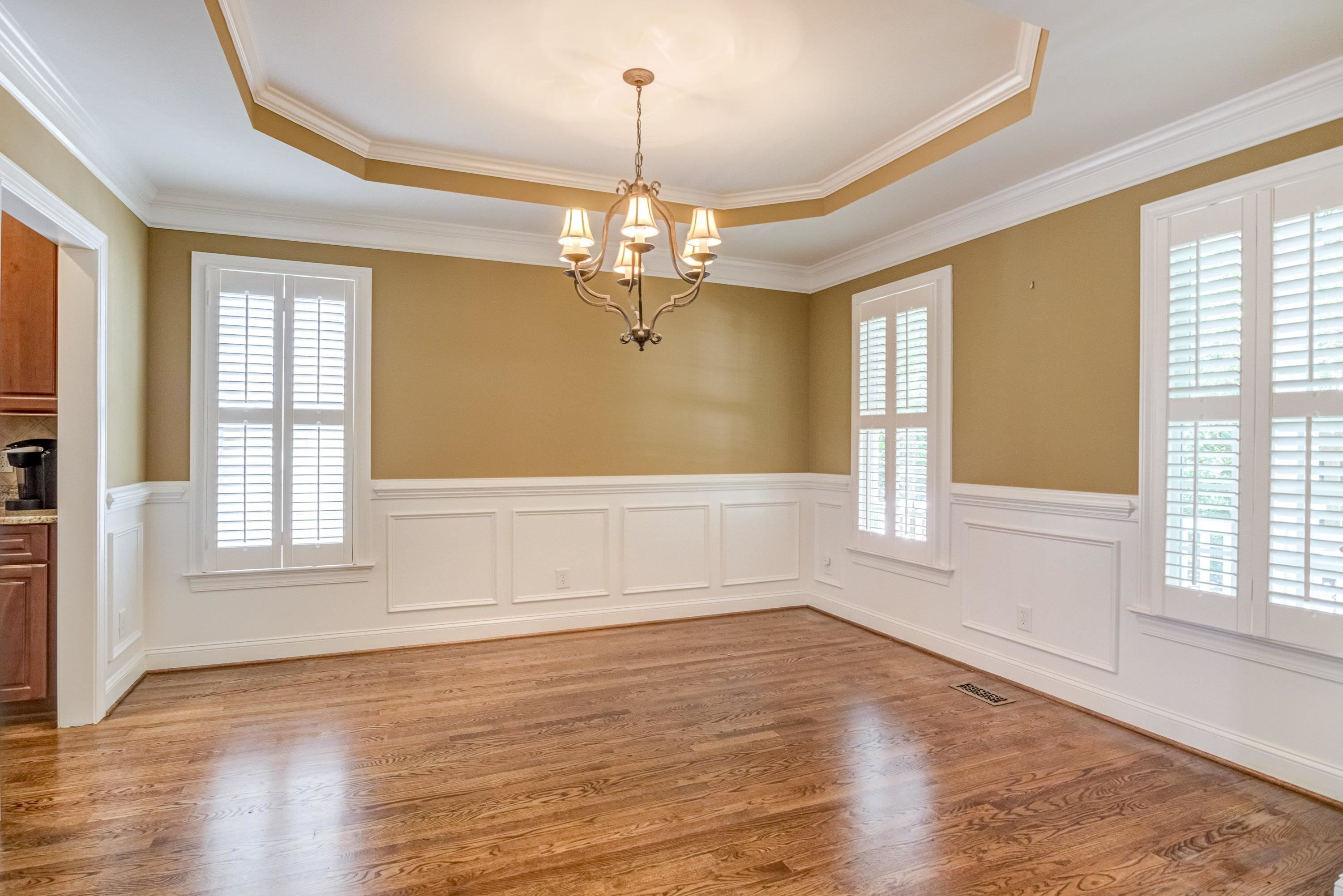 1911 Hornbeck Court Raleigh, NC 27614 - Photo 7 of 47 a view of an empty room with wooden floor and a window