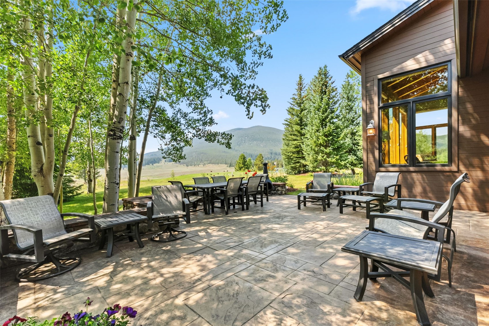 272 Penstemon Road Keystone, CO 80435 - Photo 12 of 50 Large back patio with mature aspen trees, lovely perennial gardens and the amazing views!