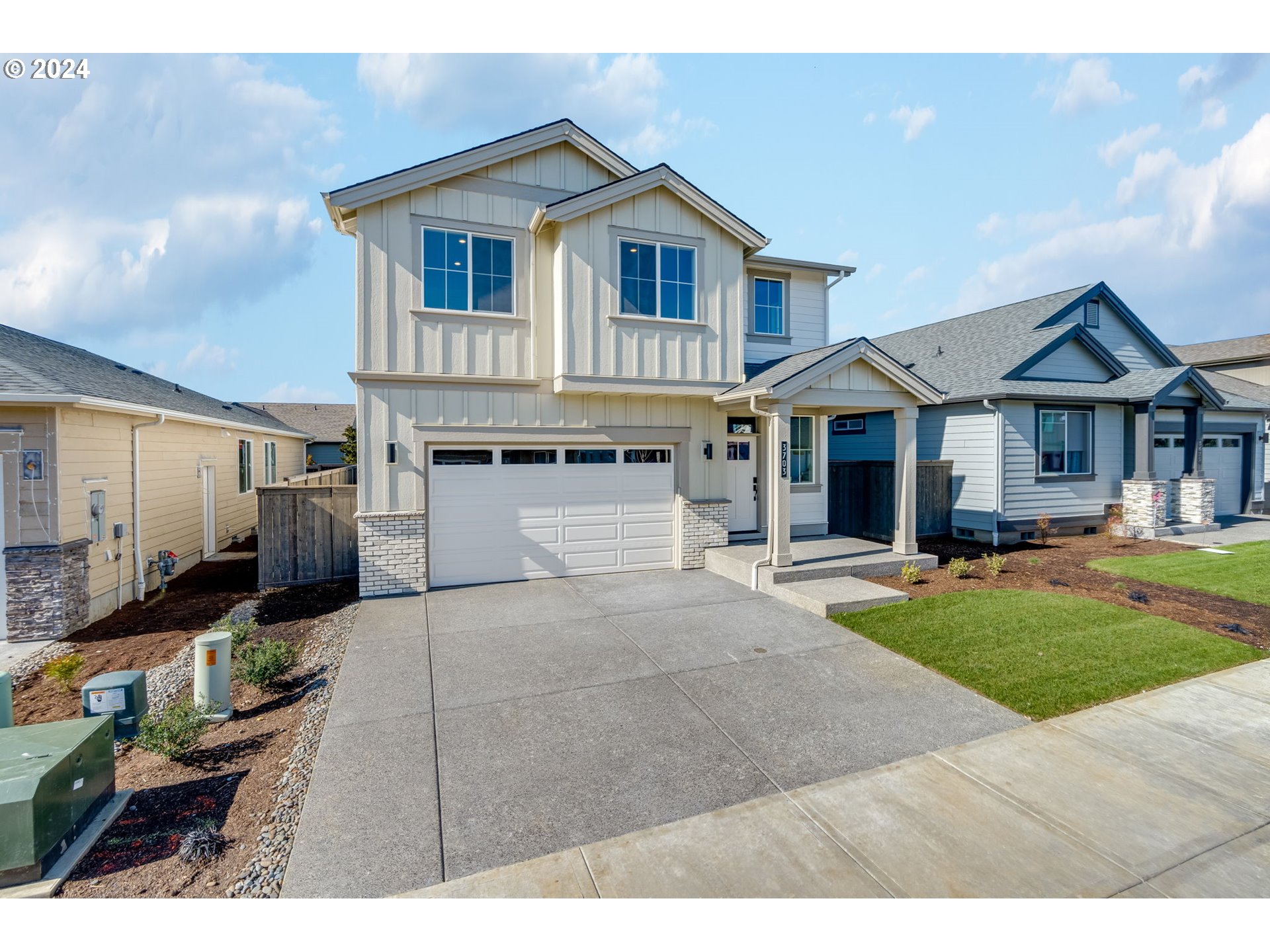 3703 South Arwana Lane Ridgefield, WA 98642 - Photo 1 of 35 a front view of a house with a yard