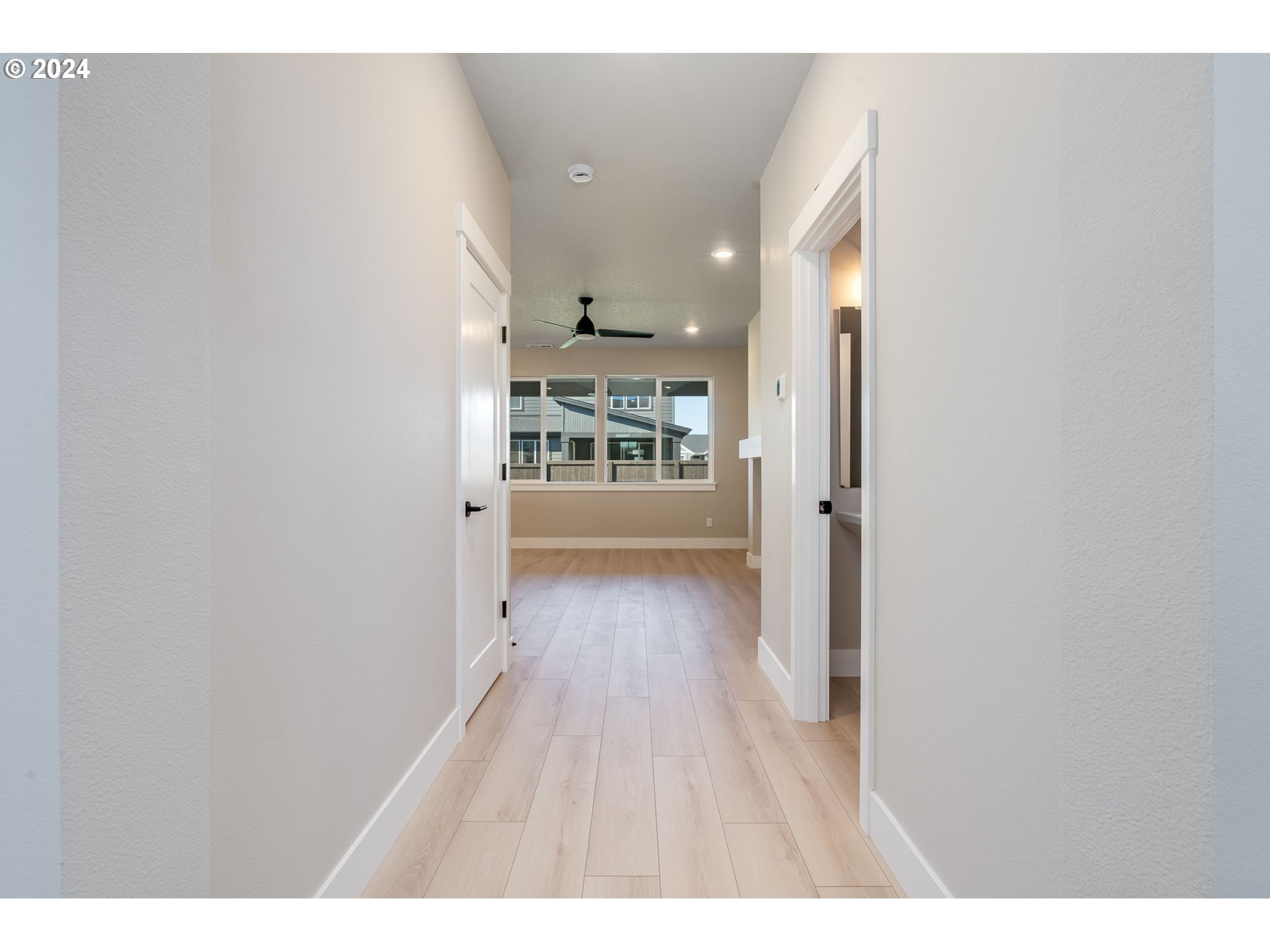 3703 South Arwana Lane Ridgefield, WA 98642 - Photo 12 of 35 a view of a hallway with wooden floor