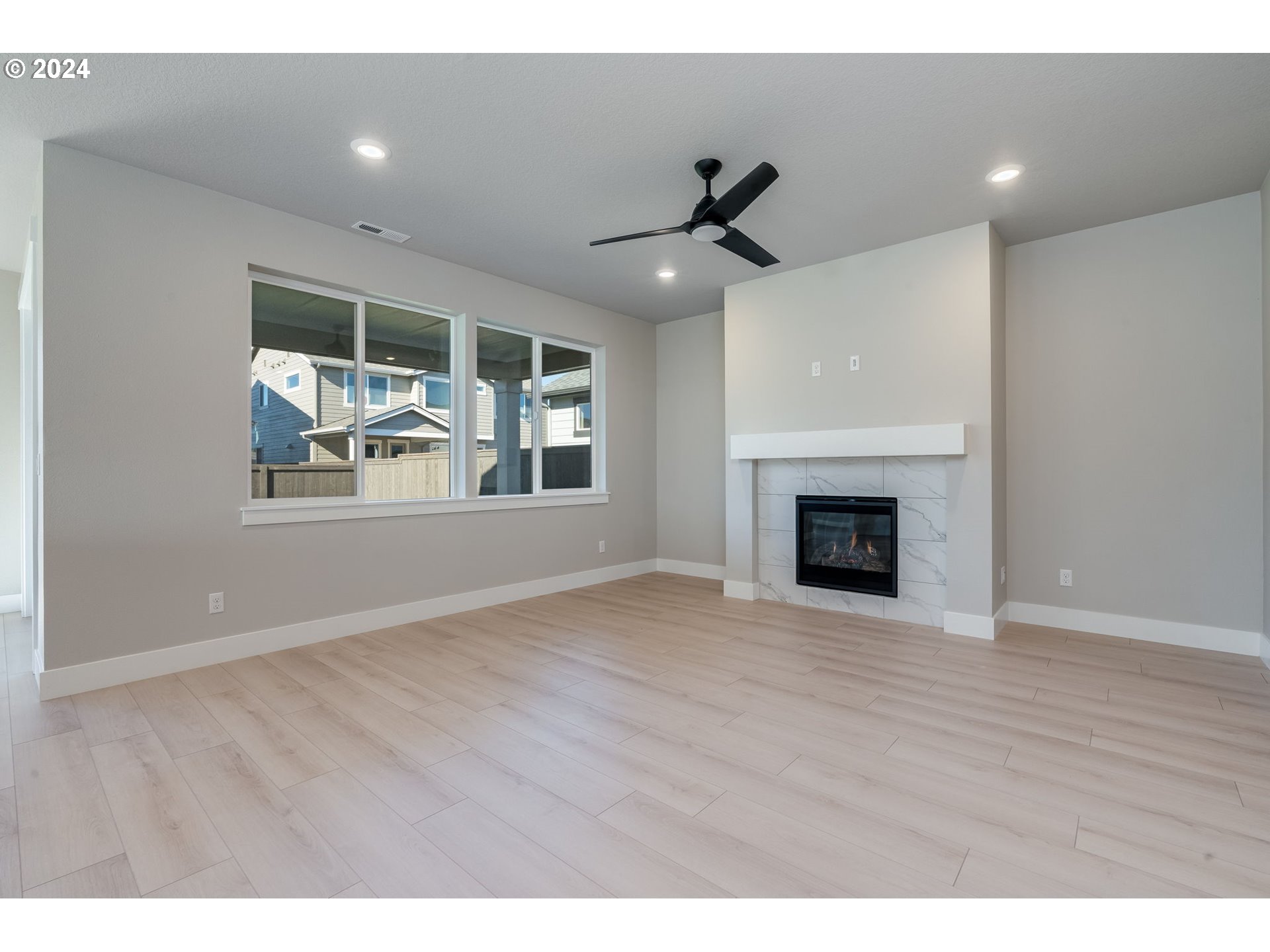 3703 South Arwana Lane Ridgefield, WA 98642 - Photo 14 of 35 a view of an empty room with a fireplace and a window