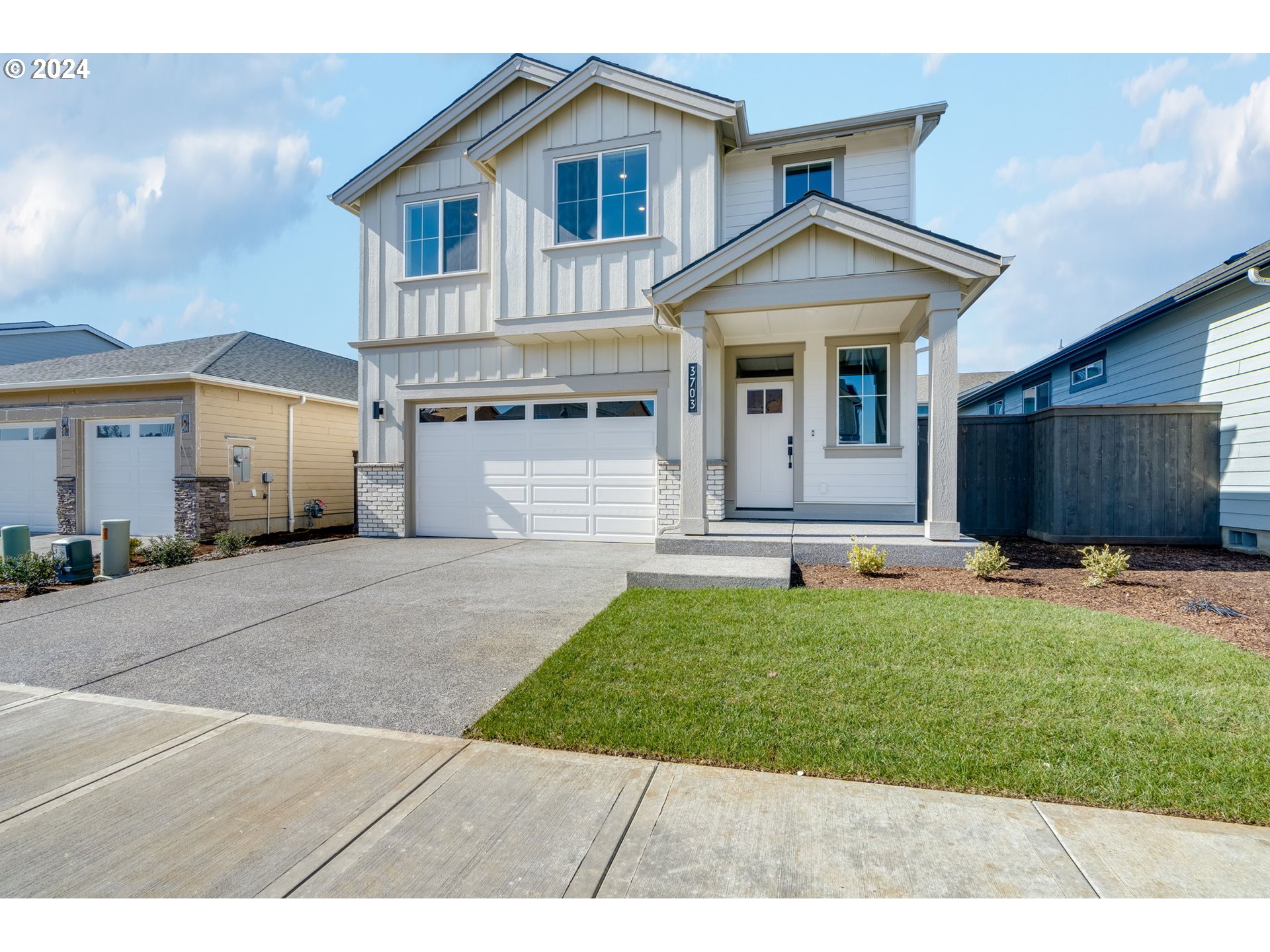 3703 South Arwana Lane Ridgefield, WA 98642 - Photo 16 of 35 a front view of a house with a yard