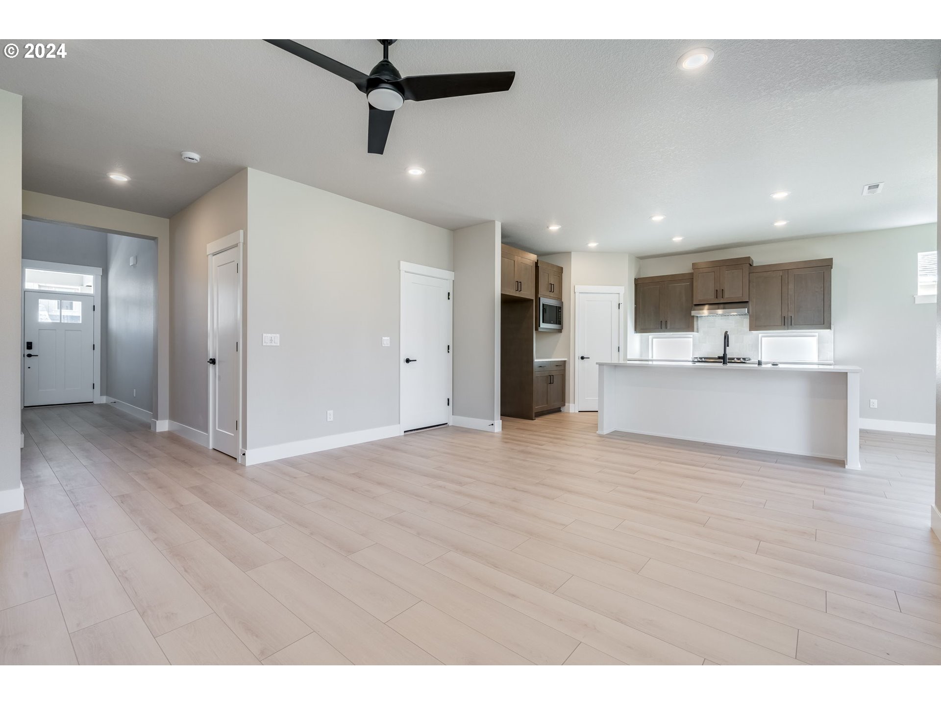3703 South Arwana Lane Ridgefield, WA 98642 - Photo 17 of 35 a view of a kitchen with a sink and a refrigerator