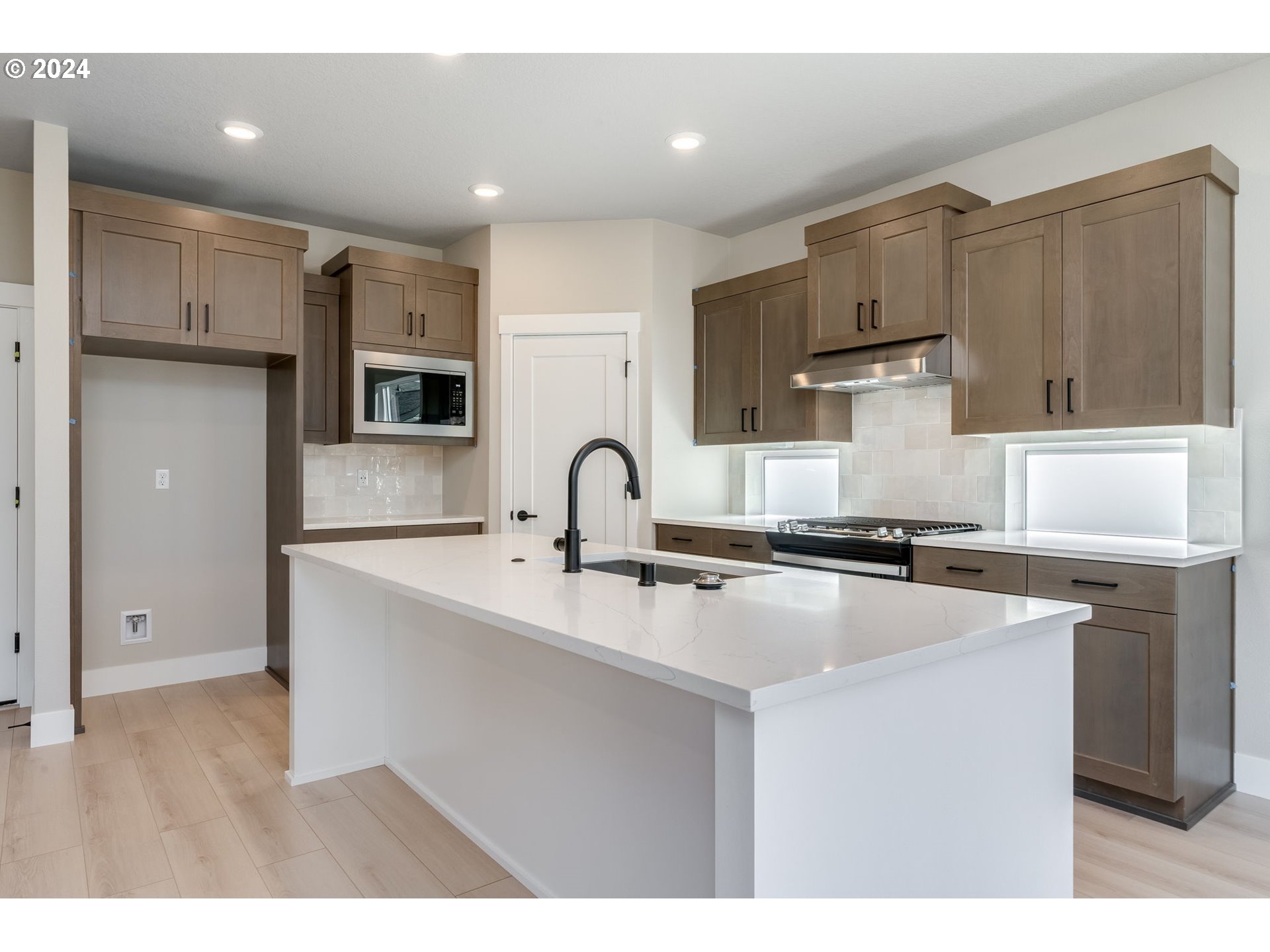 3703 South Arwana Lane Ridgefield, WA 98642 - Photo 19 of 35 a kitchen with stainless steel appliances granite countertop a sink stove and refrigerator
