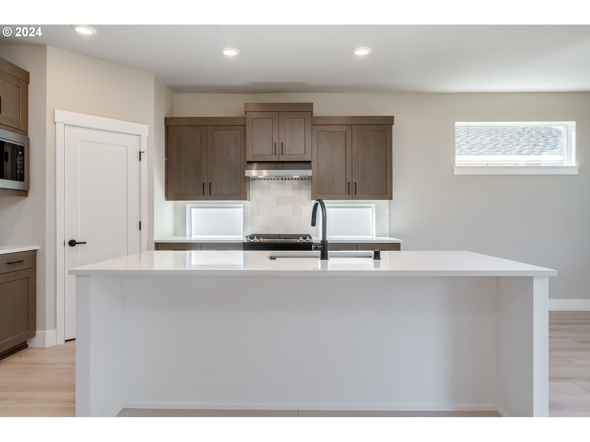 3703 South Arwana Lane Ridgefield, WA 98642 - Photo 20 of 35 a kitchen with a sink stainless steel appliances and cabinets