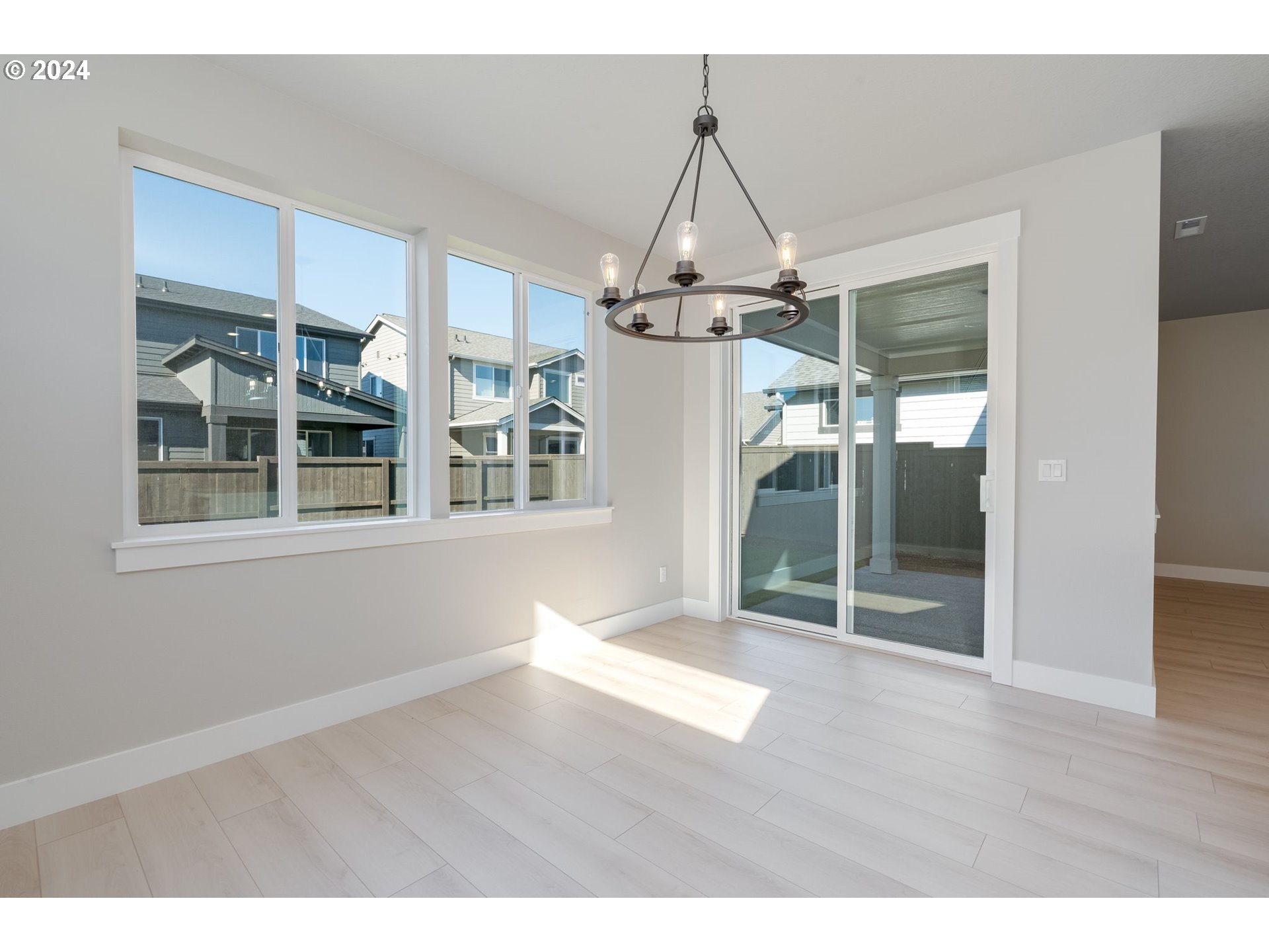 3703 South Arwana Lane Ridgefield, WA 98642 - Photo 22 of 35 a view of a room with wooden floor chandeliers and entryway