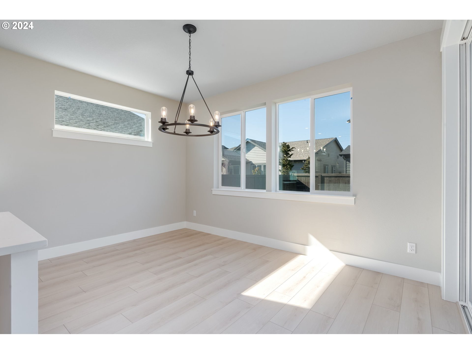 3703 South Arwana Lane Ridgefield, WA 98642 - Photo 23 of 35 a view interior of a house with wooden floor chandelier and windows