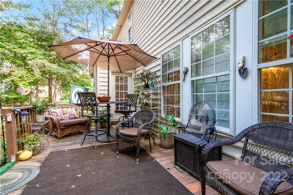 7545 Windy Pine Circle, Unit 30 Denver, NC 28037 - Photo 22 of 38 a patio with patio a couch and chairs