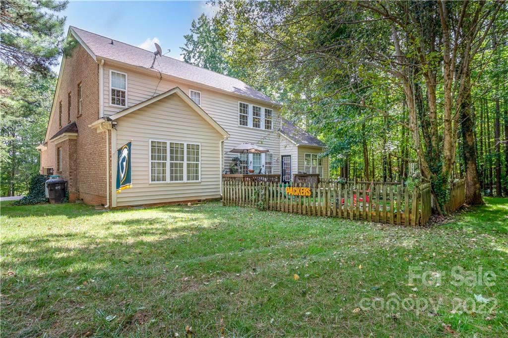 7545 Windy Pine Circle, Unit 30 Denver, NC 28037 - Photo 25 of 38 a view of a house with a yard and porch