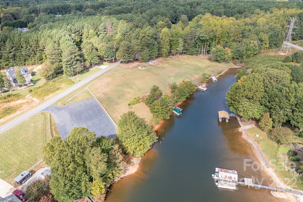 7545 Windy Pine Circle, Unit 30 Denver, NC 28037 - Photo 33 of 38 a view of a lake with a yard