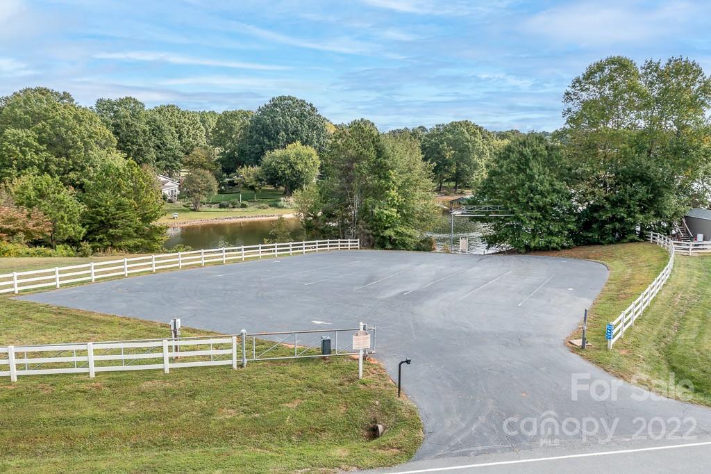 7545 Windy Pine Circle, Unit 30 Denver, NC 28037 - Photo 35 of 38 a view of a swimming pool with a yard and large trees