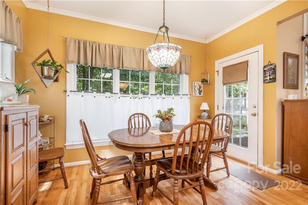 7545 Windy Pine Circle, Unit 30 Denver, NC 28037 - Photo 8 of 38 a dining room with furniture a chandelier and wooden floor
