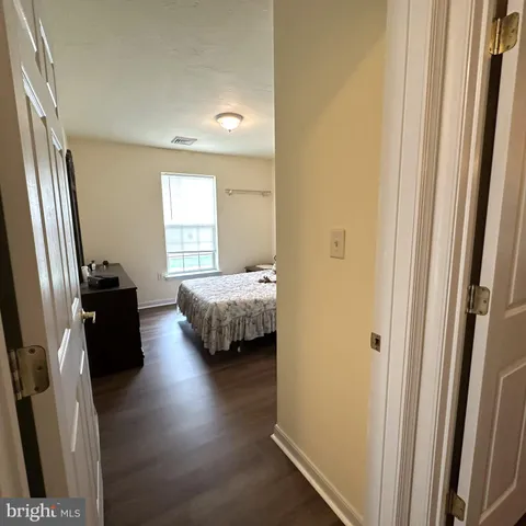 a bedroom with bed and window