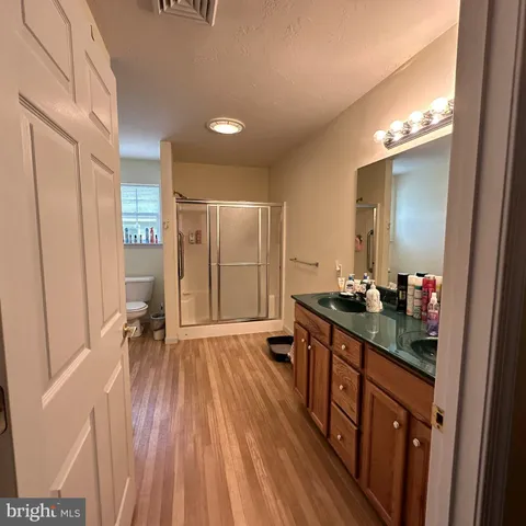 a en suite bathroom with a sink and a mirror