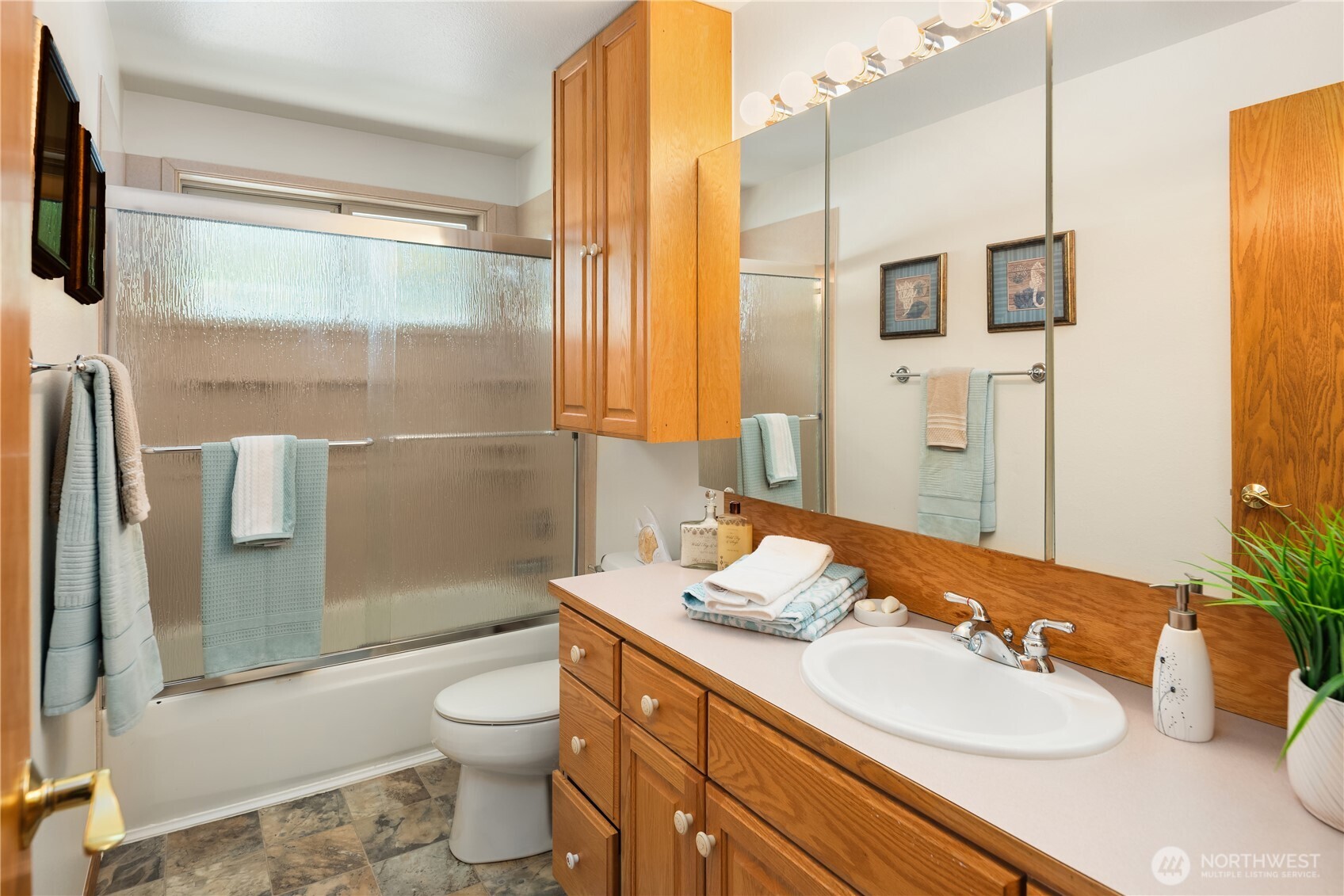22809 38th Avenue Southeast Bothell, WA 98021 - Photo 21 of 40 a bathroom with a sink a toilet and shower